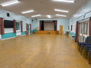 Picture of large main hall showing a stage at one end.